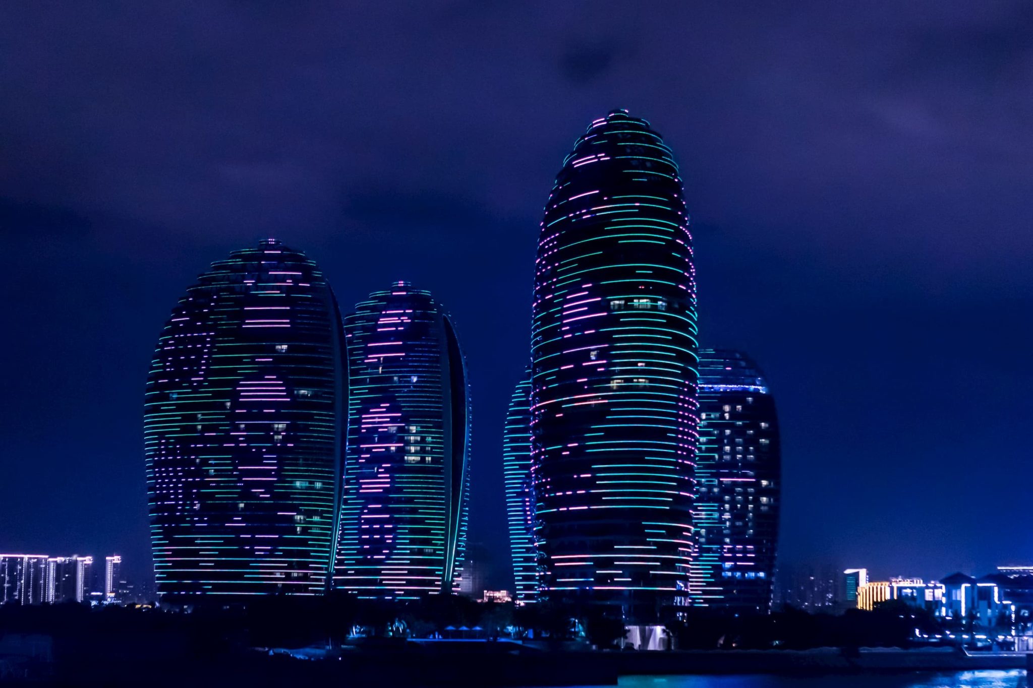 Glowing buildings at night in Sanya, China.